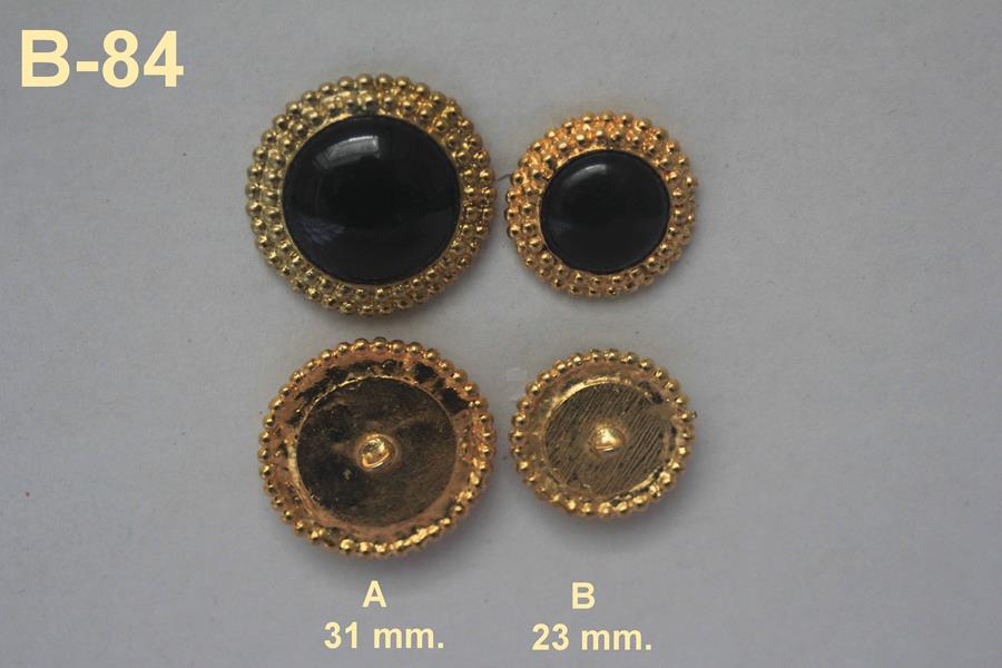 Botón joya Chanel dorado y negro